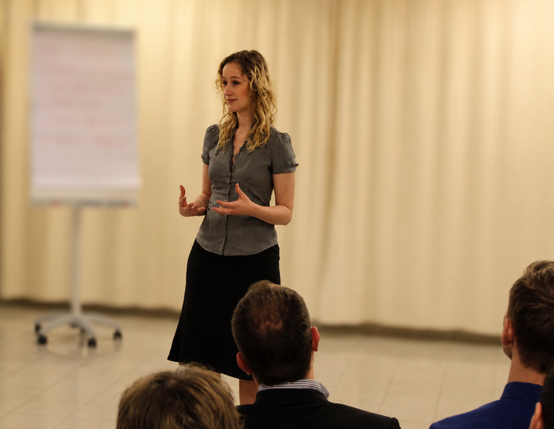 Petra speaking in front of an audience